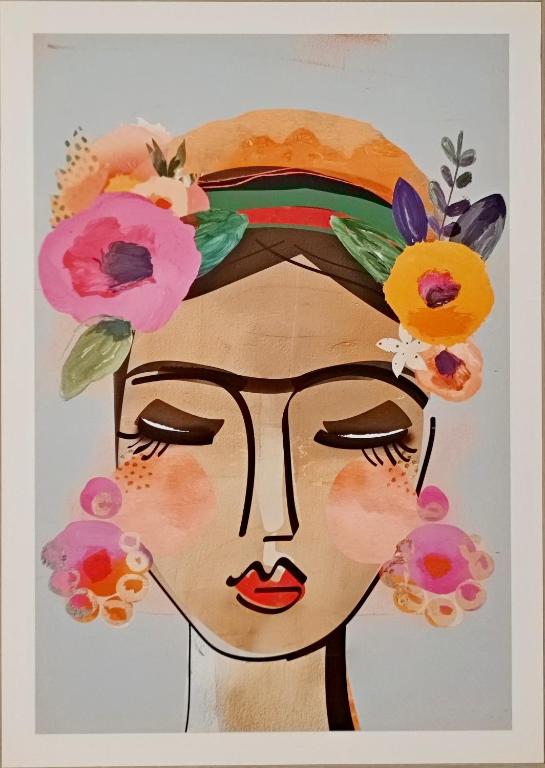 a painting of a woman with flowers on her head at Thalassa Beach Resort - 107 in Vokolidha