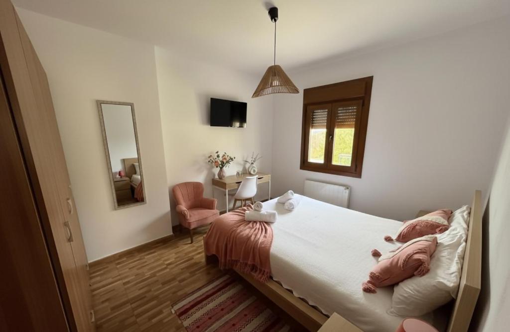 a bedroom with a large bed and a mirror at Casa rural Solpor in Vigo