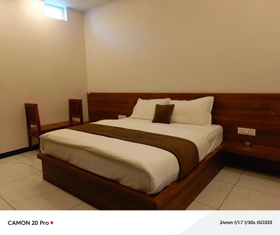 a bedroom with a large bed in a room at Hotel Pushkar Town in Pushkar