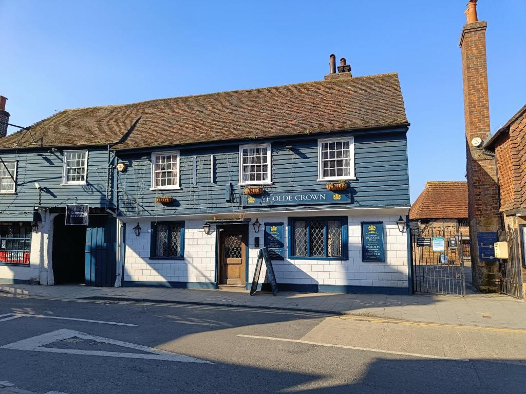 an old blue and white building on a street at Ye Olde Crown in Edenbridge