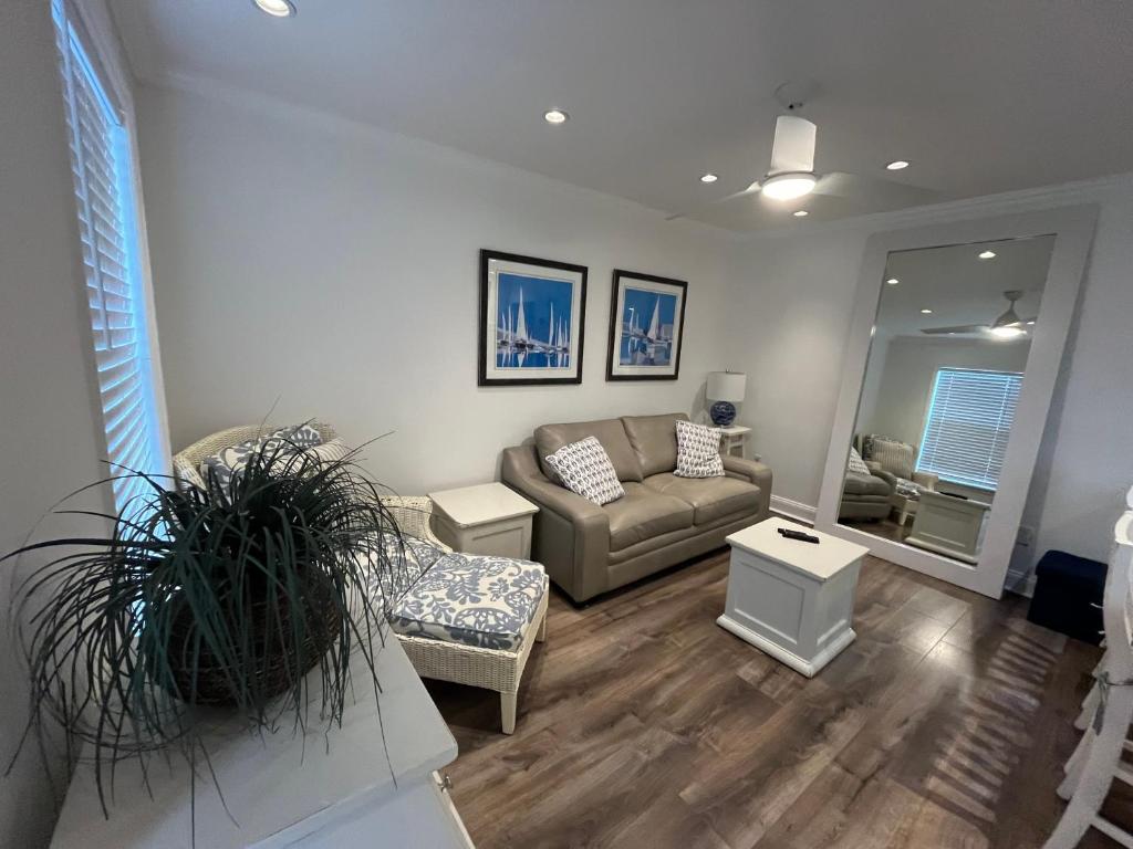 a living room with a couch and a table at Beachside One Bedroom Condo with Pool Access in Hollywood
