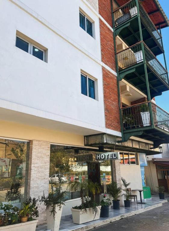 a hotel with balconies on the side of a building at MON Hotel Boutique in Constanza