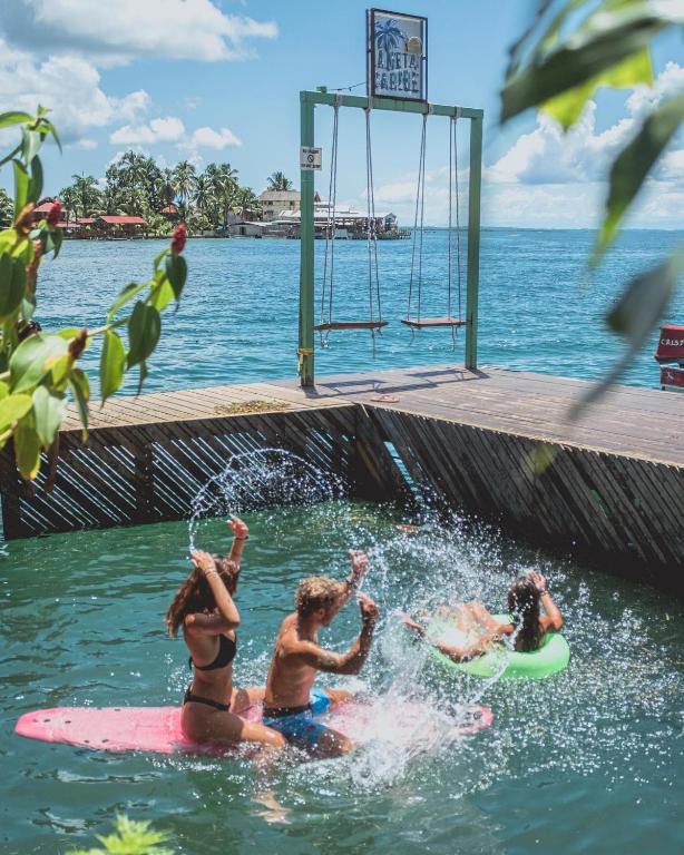 three people in the water playing in the water at Klika Bocas del Toro in Bocas Town