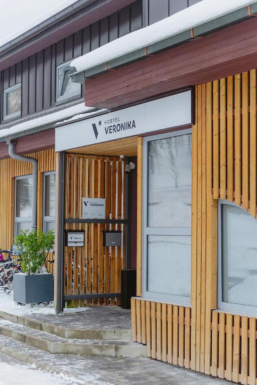 a store front of a building with a sign on it at Hostel Veronika Celje in Celje