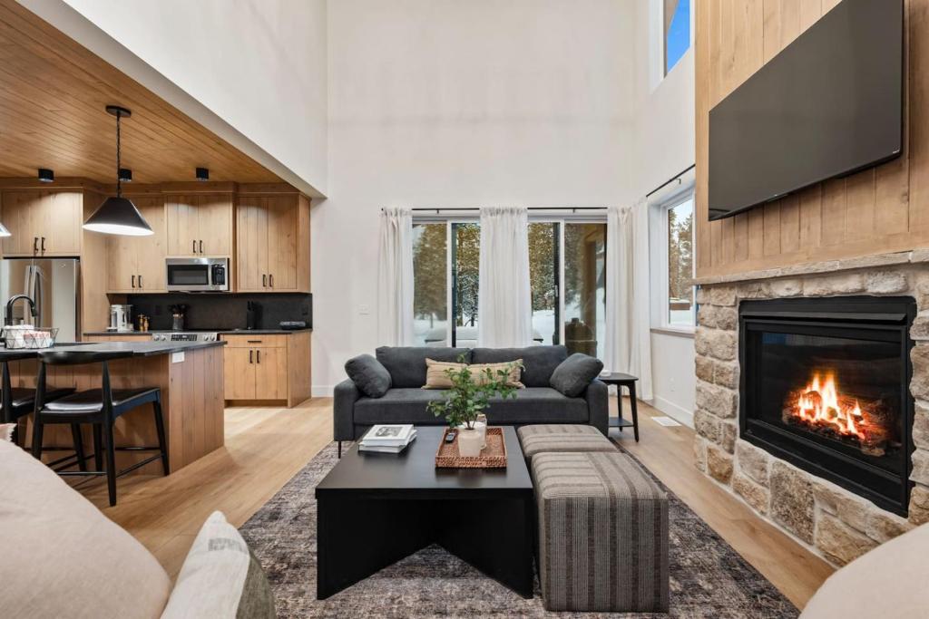 a living room with a couch and a fireplace at The Dacha in Island Park