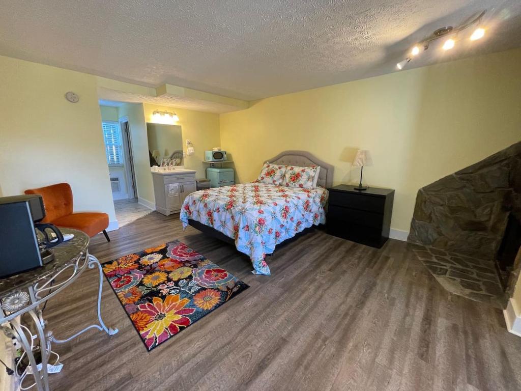 a bedroom with a bed and a living room at Bavarian Brook Unit 3 in Helen