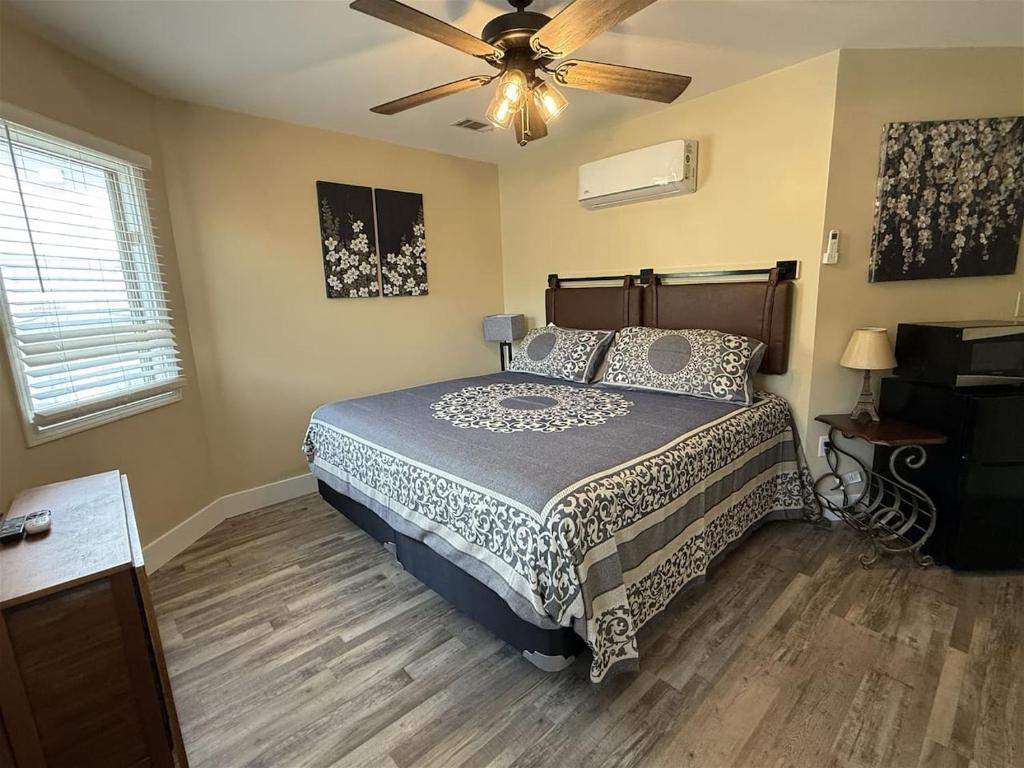 a bedroom with a bed and a ceiling fan at Rivers Edge 703A in Helen
