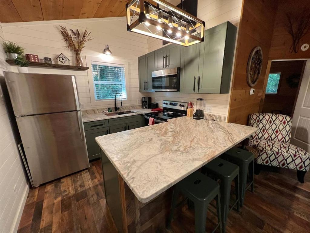 a kitchen with a counter top and a refrigerator at Bavarian Hideaway 25 in Helen