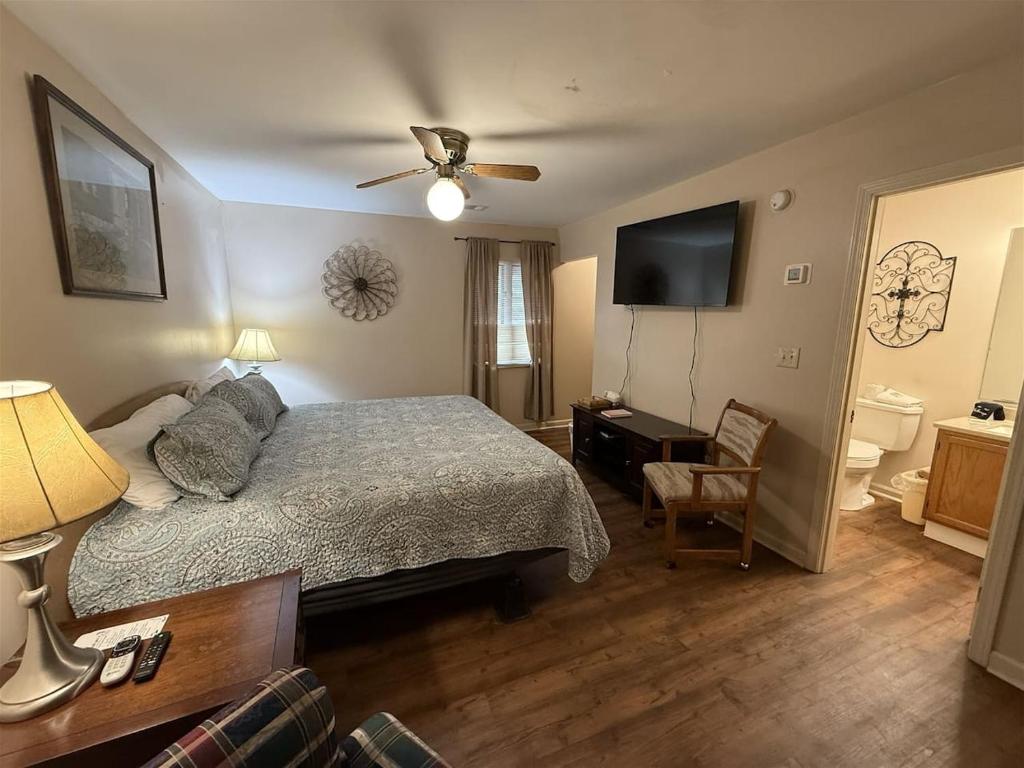 a bedroom with a bed and a flat screen tv at Rivers Edge 803B in Helen