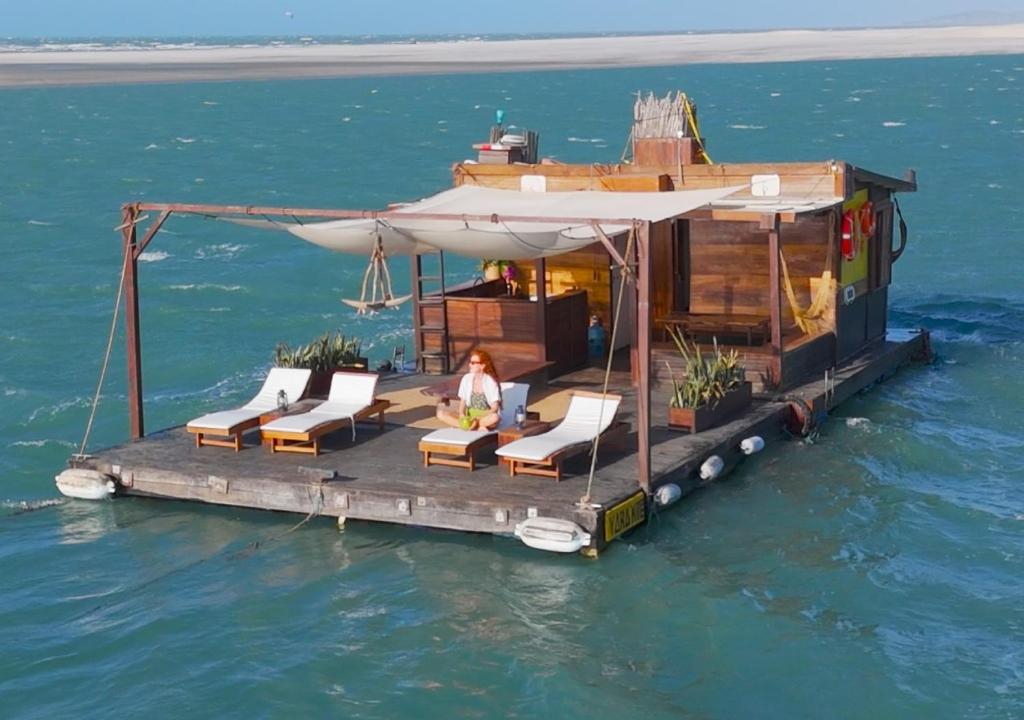 a house on a floating dock in the water at Yara Floating Villa in Guriú