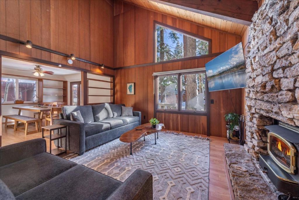 a living room with a couch and a fireplace at Dollar Point - Observation Dr, home in Tahoe City
