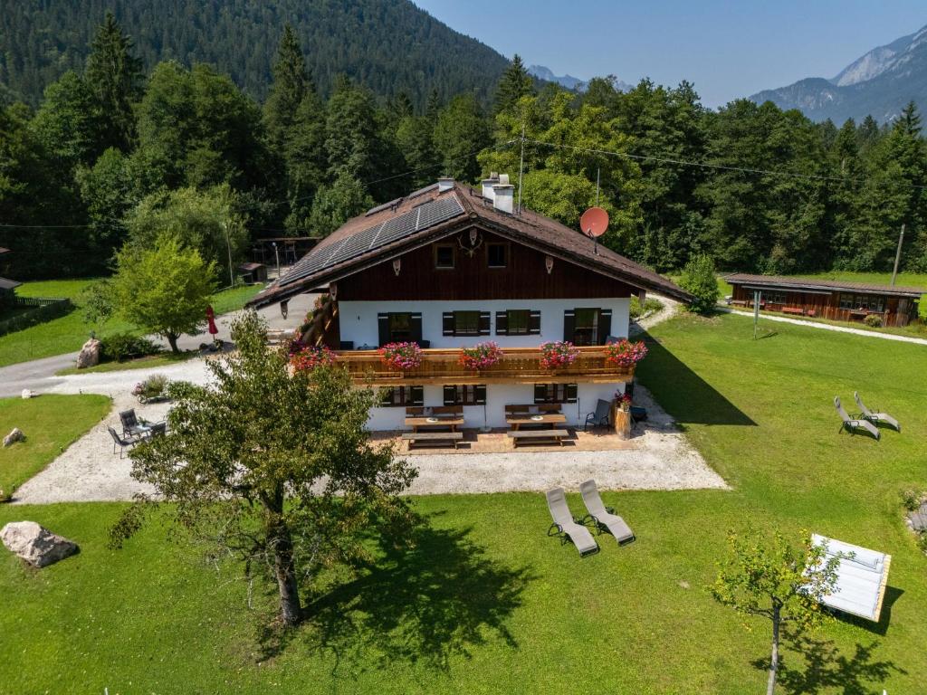 an aerial view of a house in a field at Pension Mooserlehen in Bischofswiesen