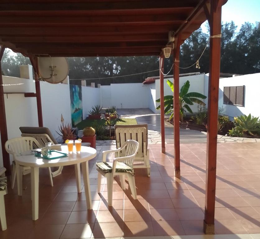 a patio with a table and chairs on a patio at FRAMANTIS App No 6 in Costa Calma