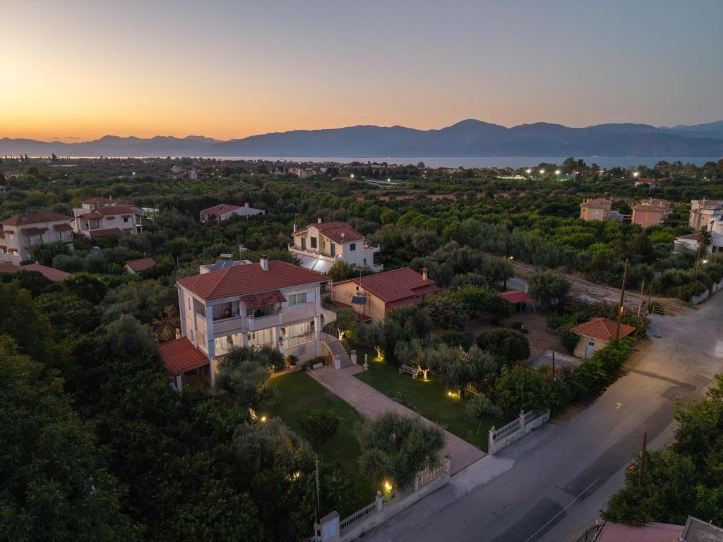 an aerial view of a house in a suburb at Azure Garden Retreat in Aigio