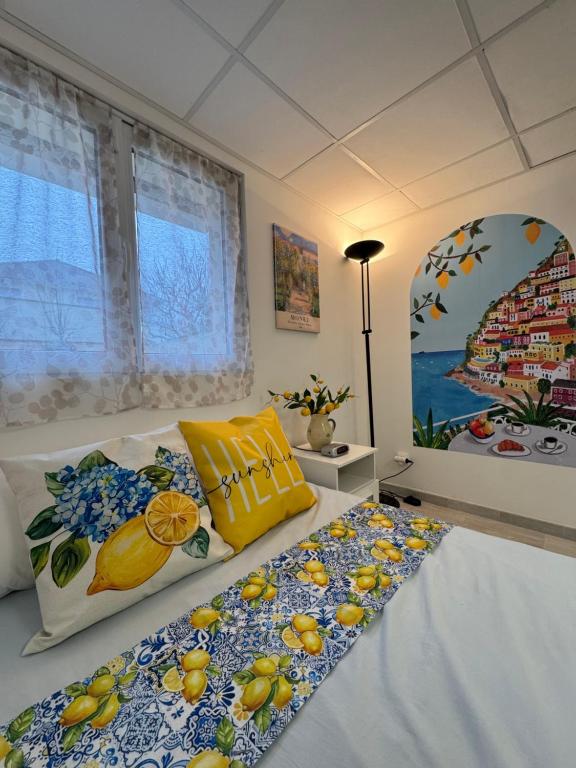 a bedroom with a bed with fruits on it at Maison d Eloise in Sartrouville