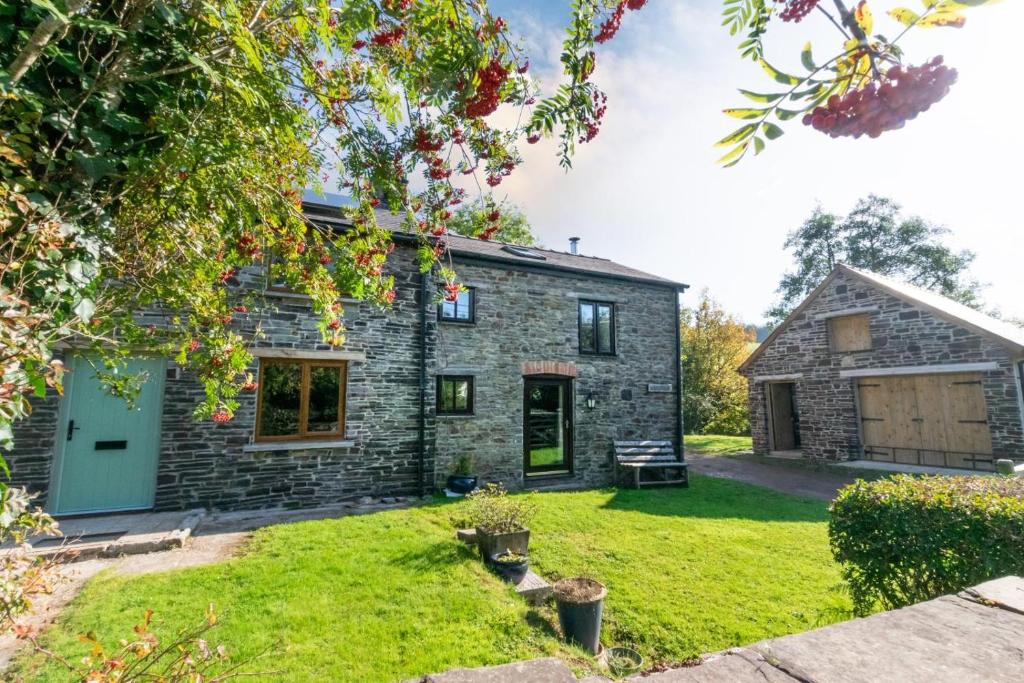 an image of a stone cottage with a yard at 2 Bed in Brecon oc-37318 in Pentre-bâch