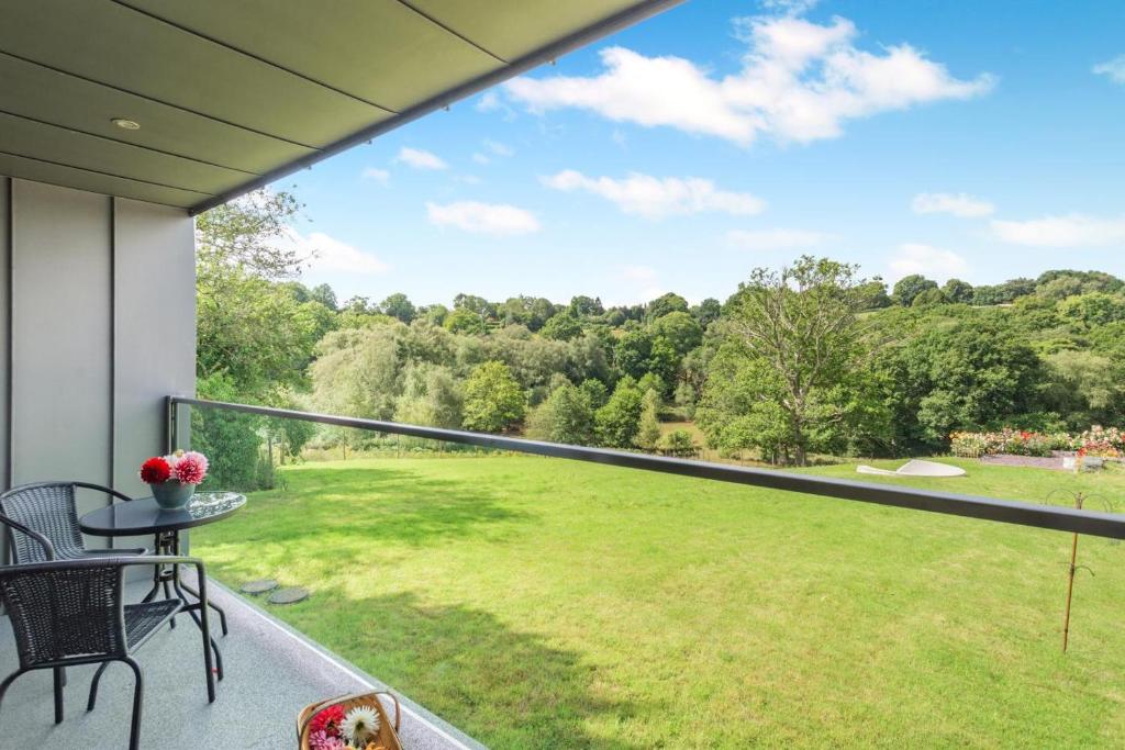 a balcony with a view of a green yard at 1 Bed in Buxted oc-t32799 in Buxted