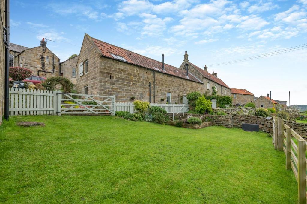 an exterior view of a house with a yard at 2 Bed in Glaisdale oc-wa306 in Glaisdale