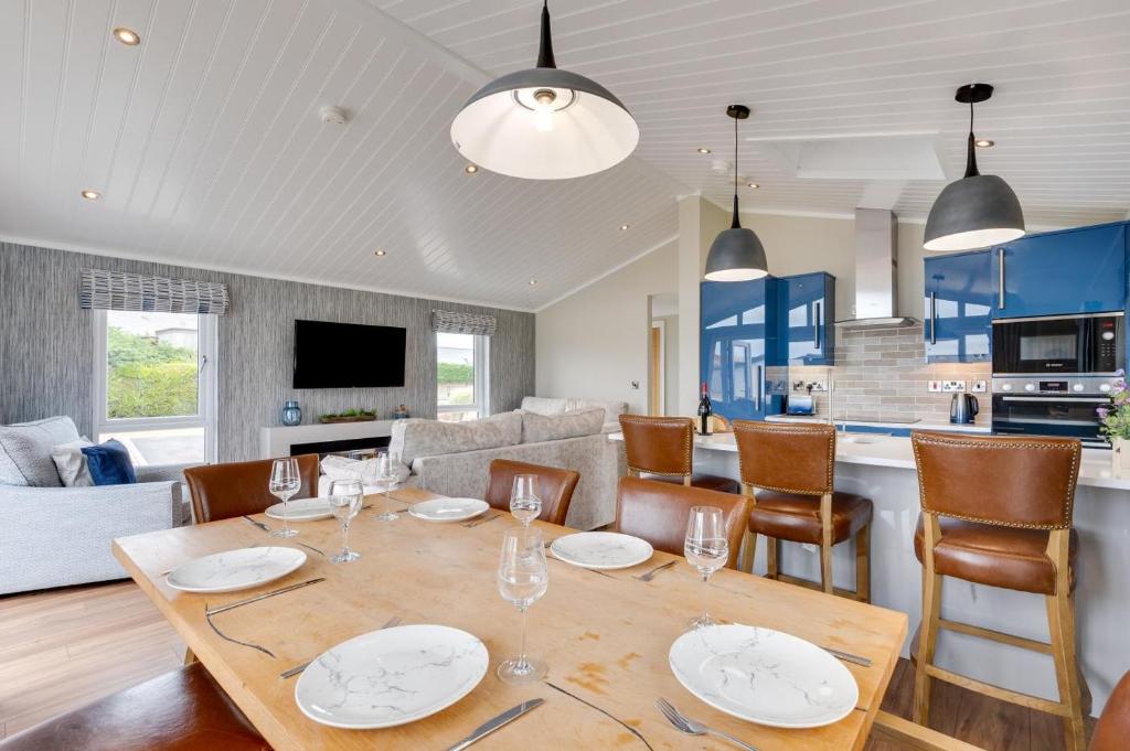 a dining room and living room with a table and chairs at 3 Bed in Burnham Market oc-2333 in Burnham Market