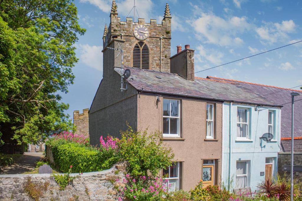 an old house with a clock tower on top of it at 2 Bed in Beaumaris oc-wai218 in Beaumaris