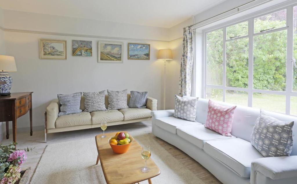 a living room with a white couch and a table at 4 Bed in Walberswick oc-ltm in Walberswick