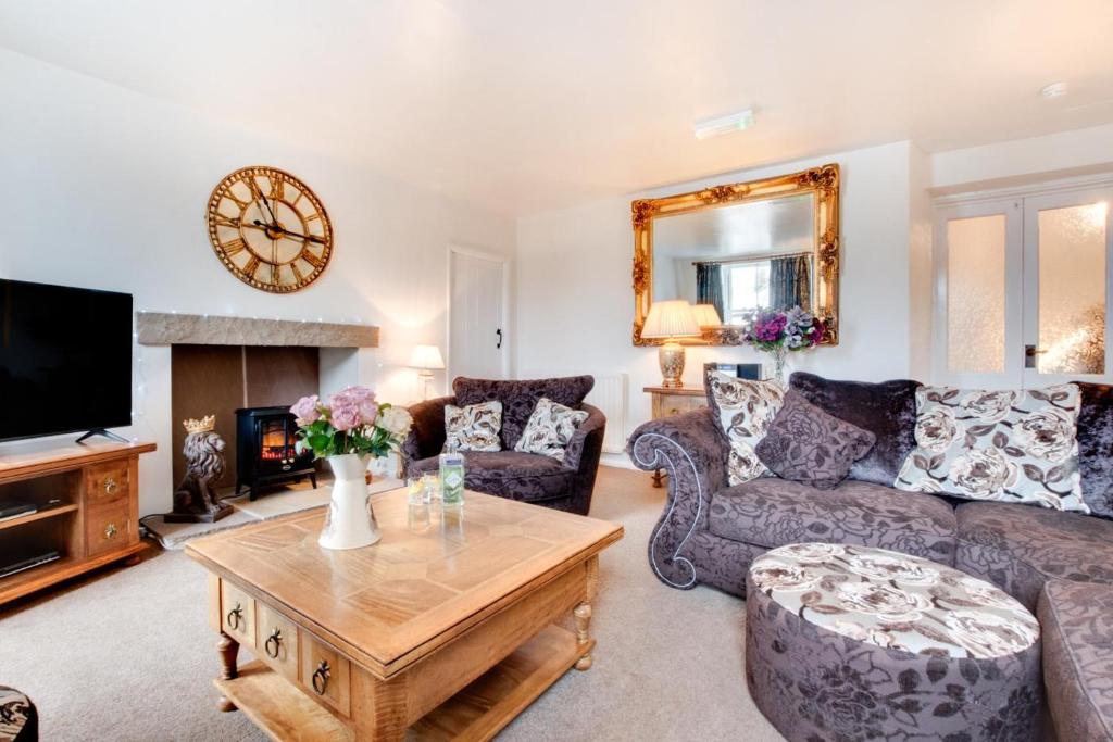 a living room with a couch and a table at 3 Bed in Hawes oc-ds1009 in Hawes