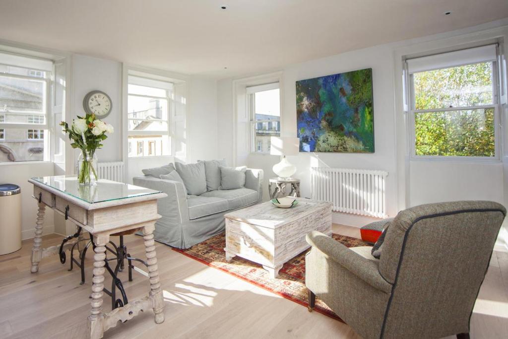 a living room with a couch and a table at 1 Bed in Bath oc-bhr48 in Bath