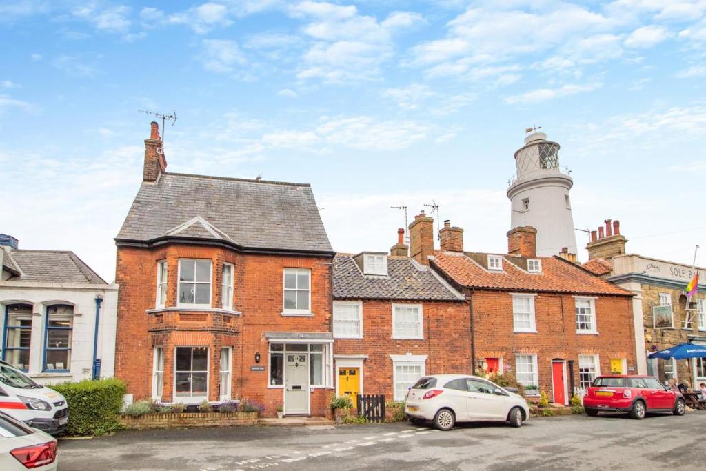 a brick building with a lighthouse on top of it at 4 Bed in Southwold oc-l29092 in Southwold