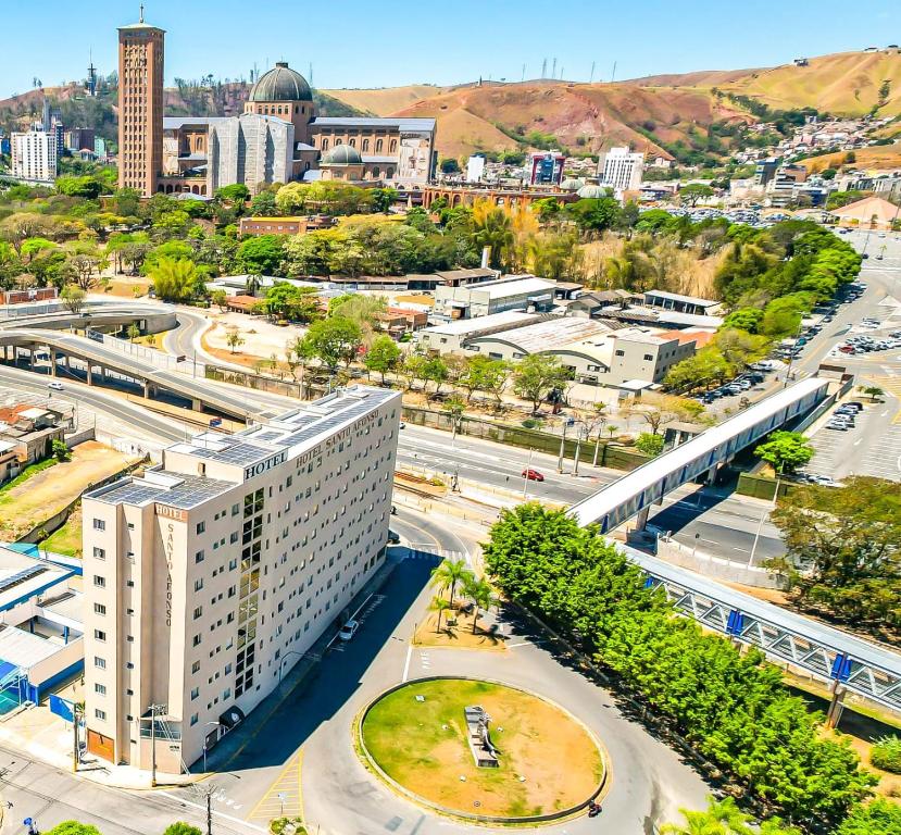 an aerial view of a city with a street at Hotel Santo Afonso in Aparecida