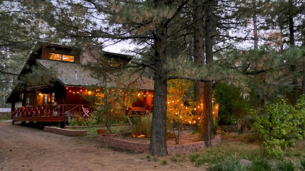 a house with christmas lights on the side of it at Artist Chalet in Flagstaff