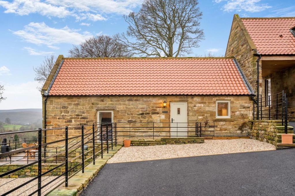 a stone house with a red roof at 2 Bed in Castleton oc-p34012 in Castleton
