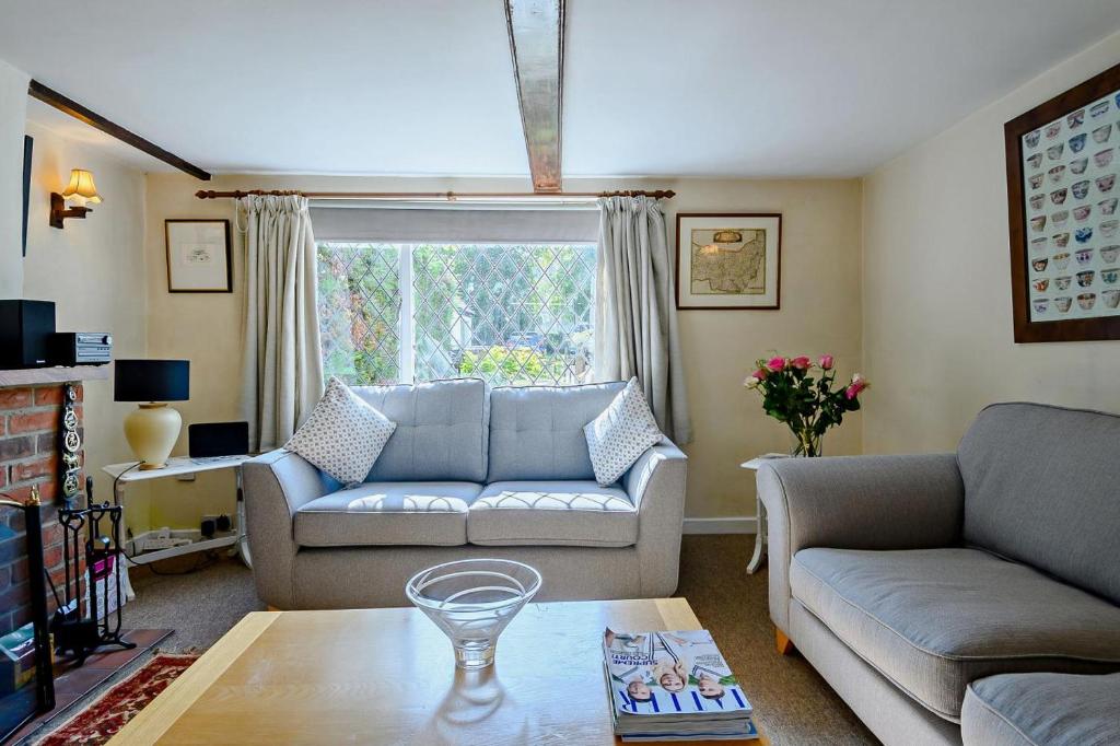 a living room with a couch and a table at 2 Bed in Dennington oc-b28010 in Dennington