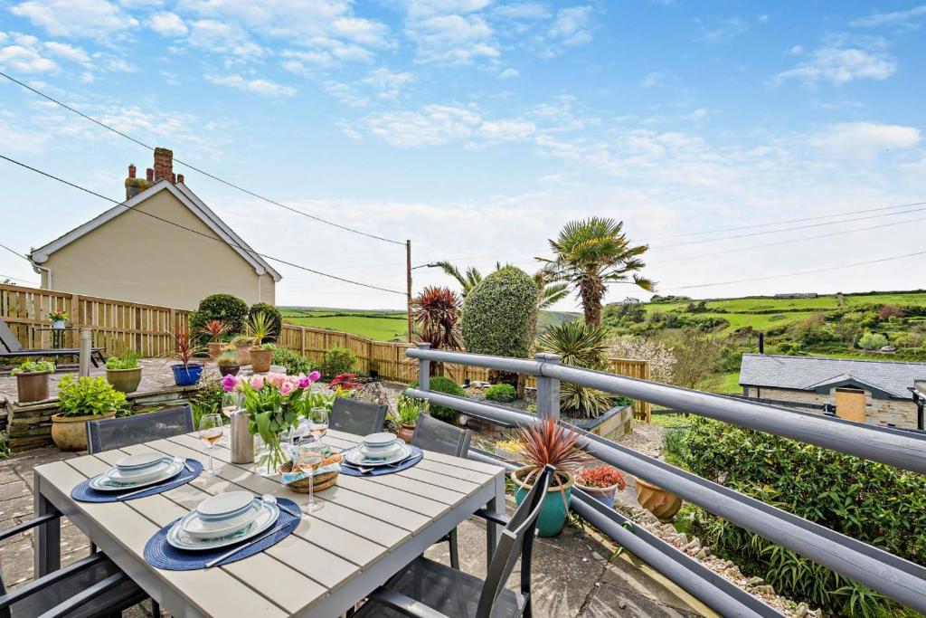 a table on the balcony of a house at 3 Bed in Treknow oc-h29194 in Treknow