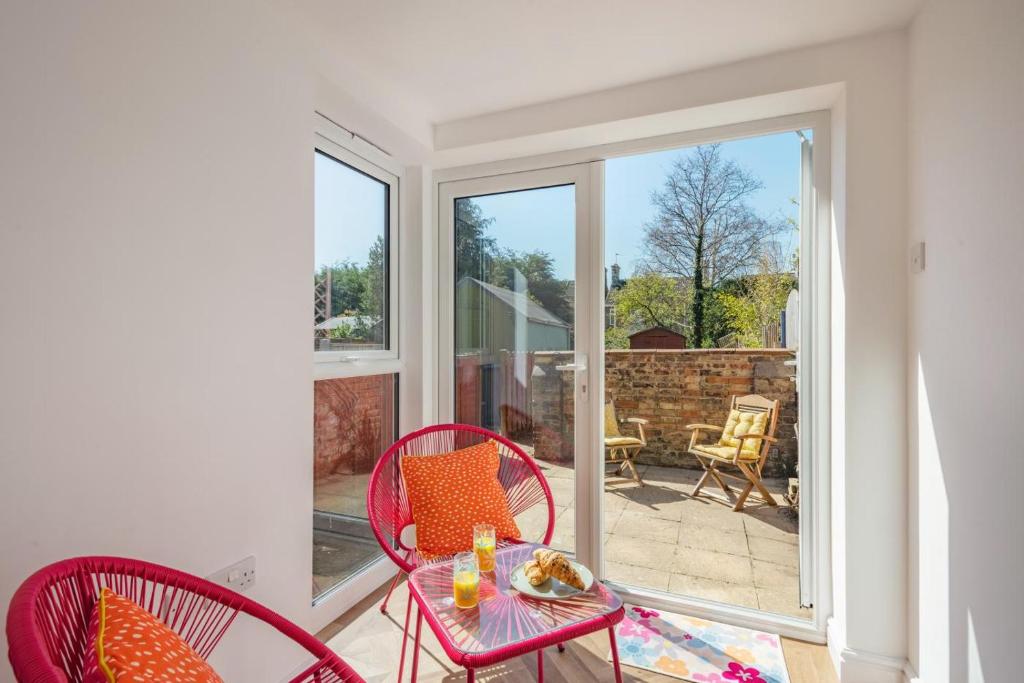 a room with a table and chairs on a patio at 2 Bed in Lowestoft oc-c31866 in Lowestoft