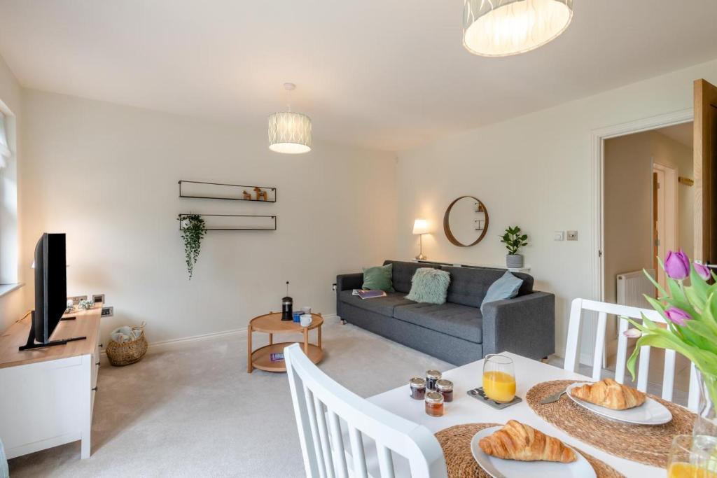 a living room with a table and a couch at 2 Bed in Mundesley oc-r31875 in Mundesley