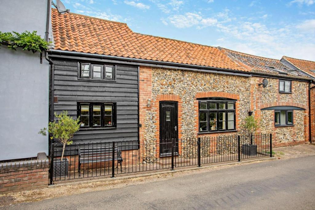 a brick house with a black exterior at 2 Bed in Rede oc-t29450 in Rede