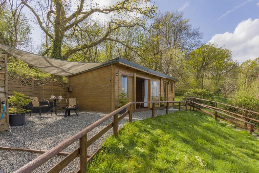 a tiny house in the woods with a hammock at 1 Bed in Latchley oc-l31925 in Sydenham Damerel