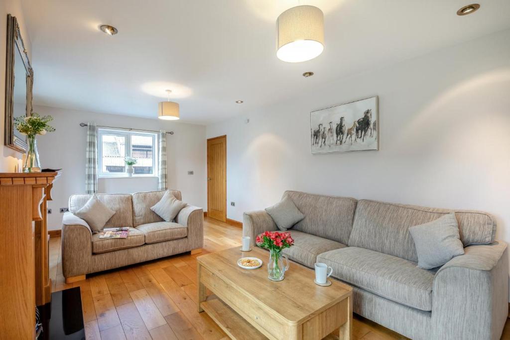 a living room with two couches and a coffee table at 2 Bed in Pickering oc-d32743 in Pickering