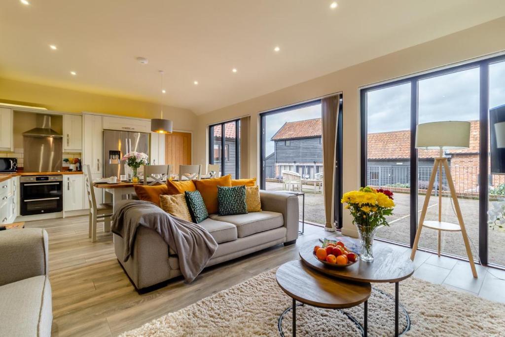 a living room with a couch and a table at 3 Bed in Heveningham oc-w29031 in Heveningham