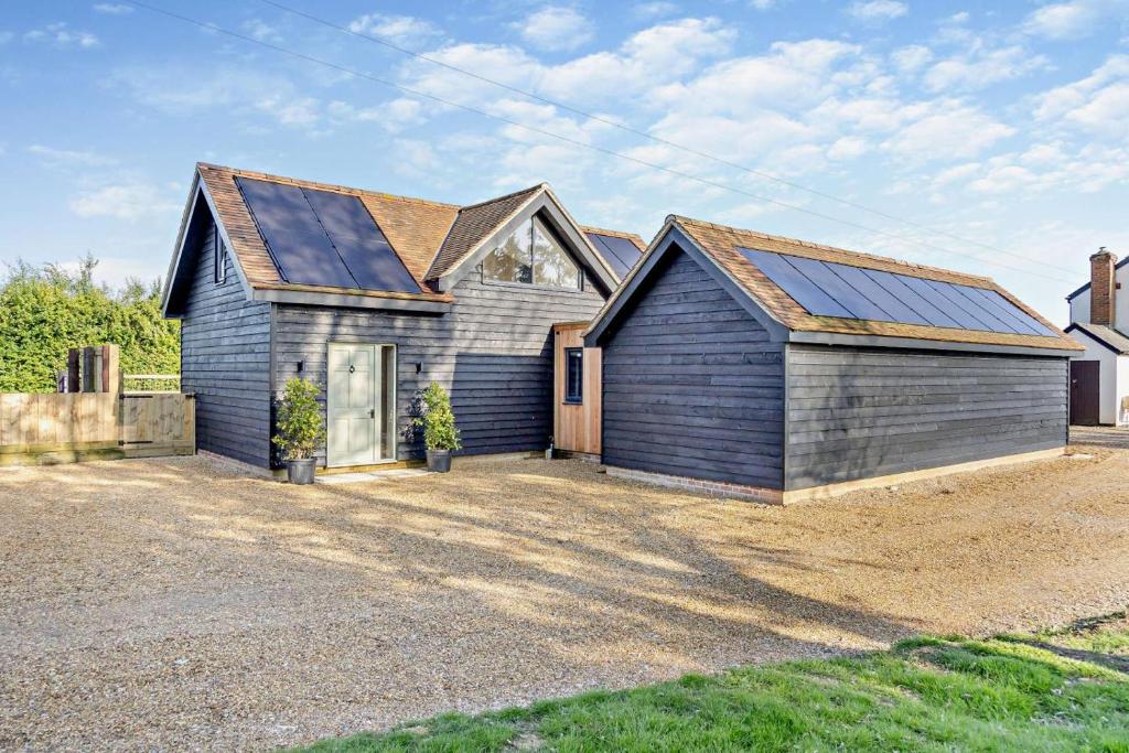 a house with solar panels on the side of it at 2 Bed in Feering oc-p29293 in Feering