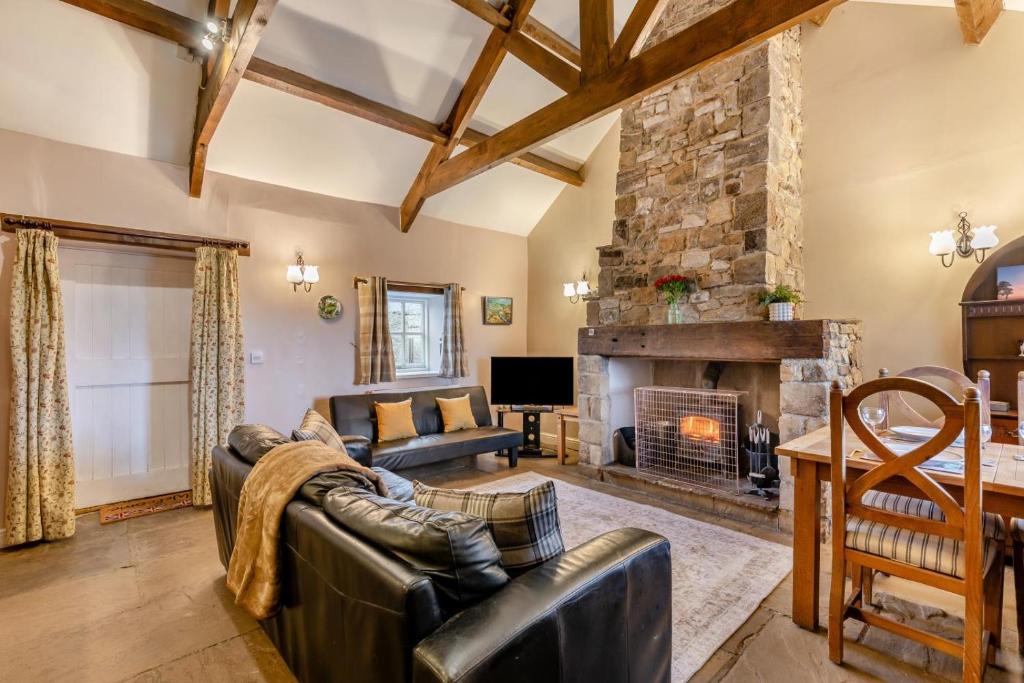 a living room with a couch and a fireplace at 2 Bed in Eggleston oc-s30453 in Middleton in Teesdale
