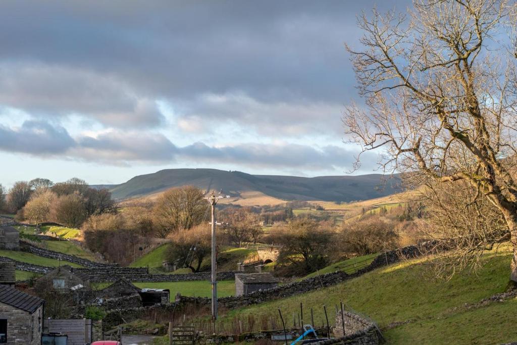 a view of a valley with mountains in the distance at 2 Bed in Hawes oc-ds1041 in Hawes