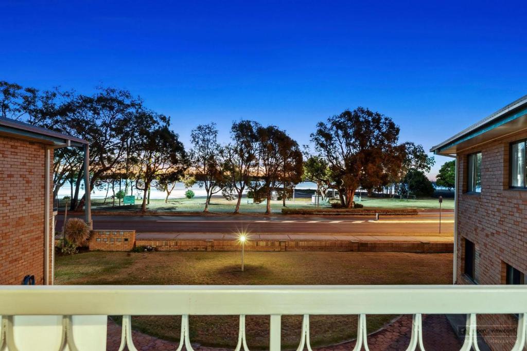 a view of a park from a balcony at Crystal Waters-2 bed, 2 bathroom, Beachfront Unit! in Bongaree