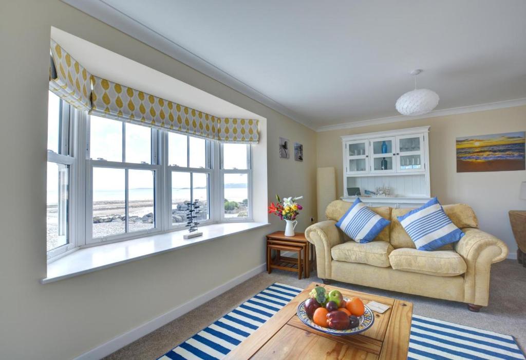 a living room with a couch and a window at 5 Bed in Amroth oc-pw9068 in Amroth