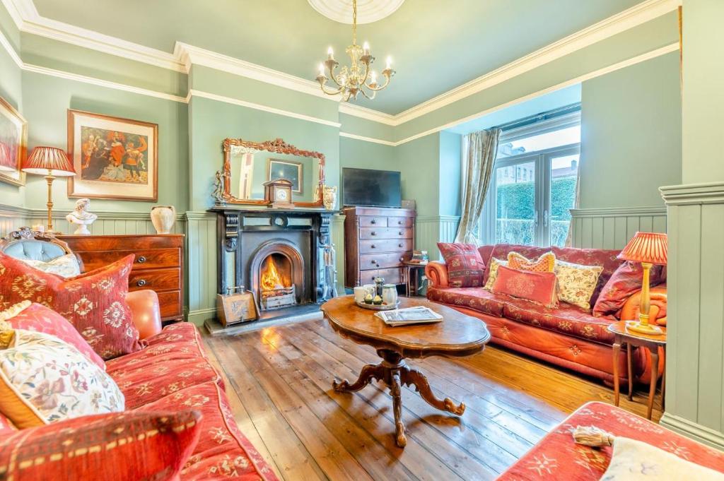 a living room with a couch and a fireplace at 4 Bed in Alnmouth oc-a30221 in Alnmouth