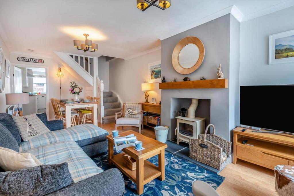 a living room with two couches and a tv at 2 Bed in Braithwaite oc-p31730 in Braithwaite