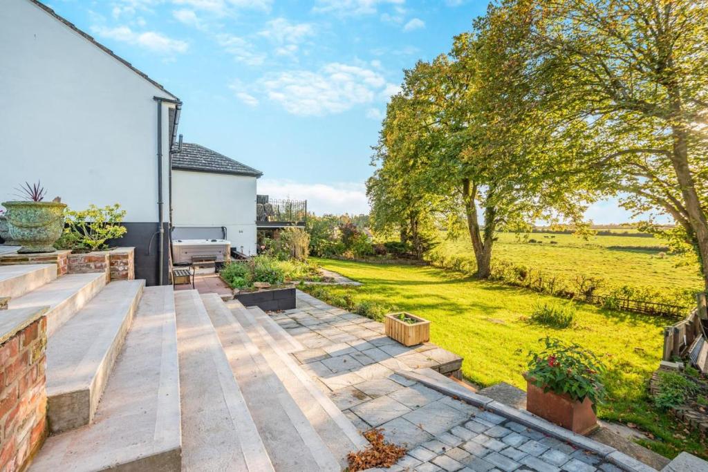 a garden with a wooden deck and a lawn at 3 Bed in Longtown oc-h30069 in Longtown