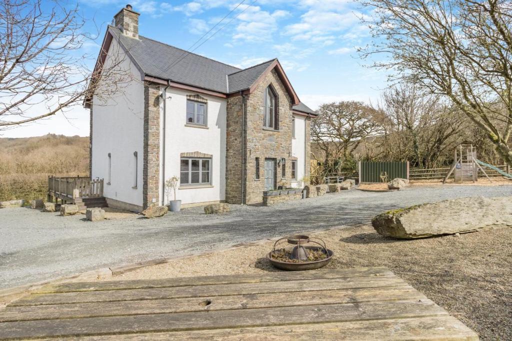 an image of a house with a driveway at 5 Bed in Ystrad Meurig oc-r31133 in Ystrad Meurig