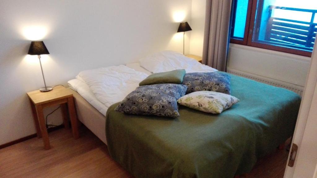 Кровать или кровати в номере Apartment Ylläs Ski Chalets 8106, 2 Hissilippua talvella