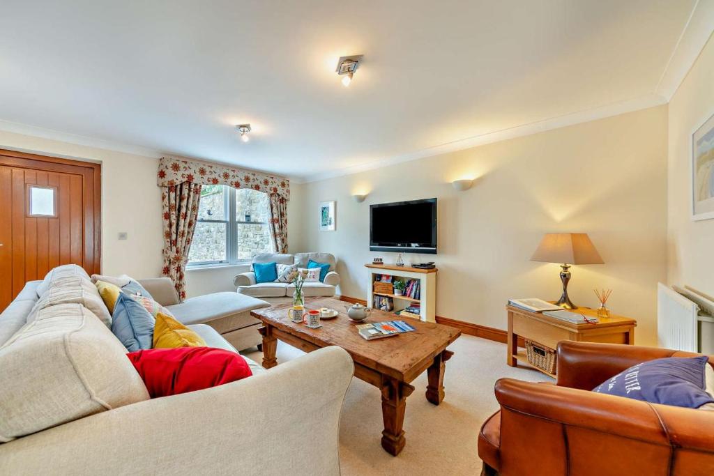 a living room with a couch and a table at 1 Bed in Beadnell oc-l29758 in Beadnell